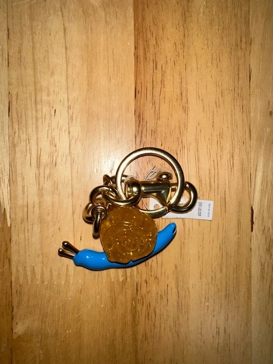Coach Gold-Tone Keychain with Blue Snail and Amber Charm - Picture 3 of 3